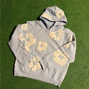 Baby blue denim tears hoodie with Cream Floral Design